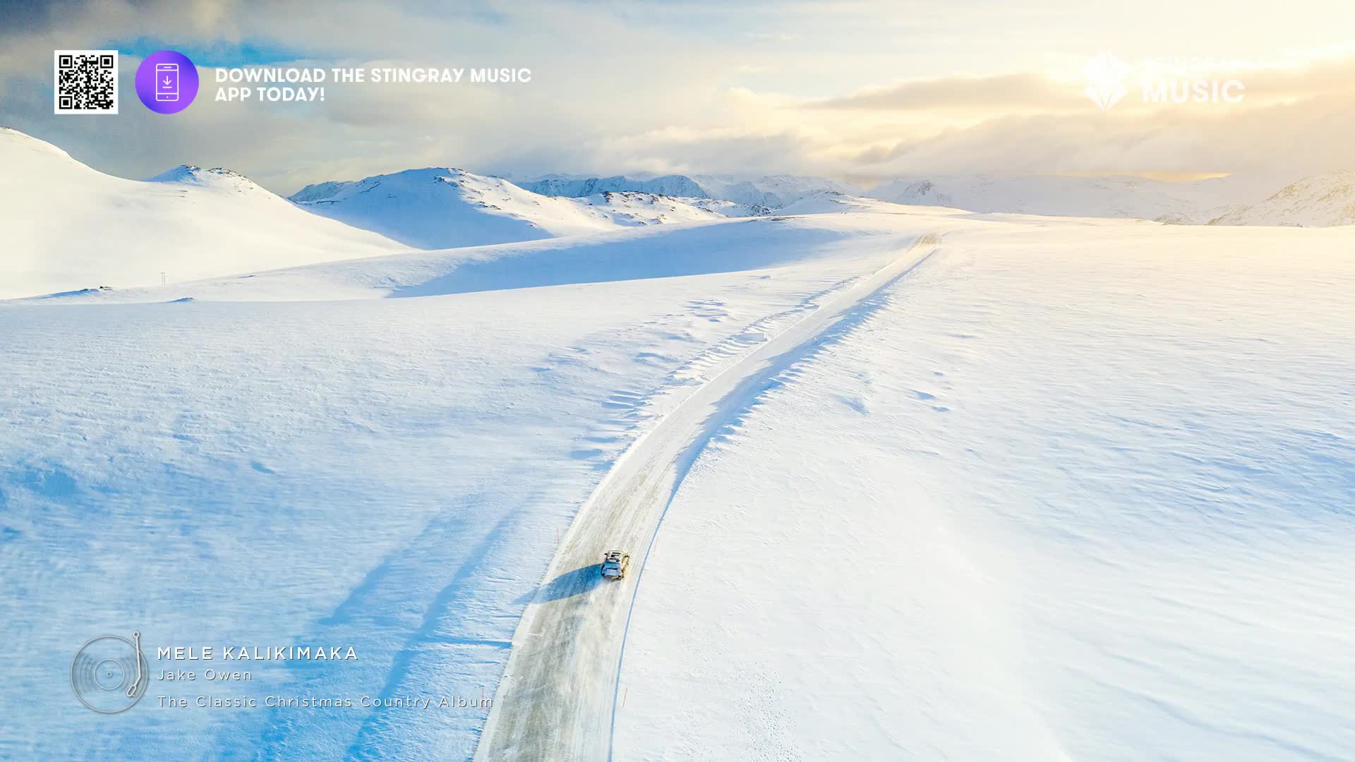 A car, small against the snowy landscape, drives along a road cut through the mountains. The sky is bright with a hint of sun, and the whole scene feels cold.
A car, small against the snowy landscape, drives along a road cut through the mountains. The sky is bright with a hint of sun, and the whole scene feels cold.