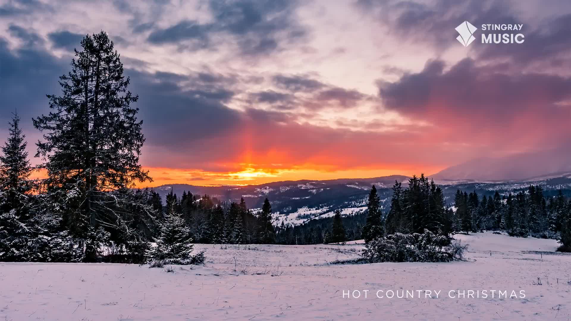 The sky blazes with orange and red as the sun dips below the snowy mountains. The scene feels like a perfect backdrop for a Hot Country Christmas, a playlist from Stingray Music in Canada.
The sky blazes with orange and red as the sun dips below the snowy mountains. The scene feels like a perfect backdrop for a Hot Country Christmas, a playlist from Stingray Music in Canada.