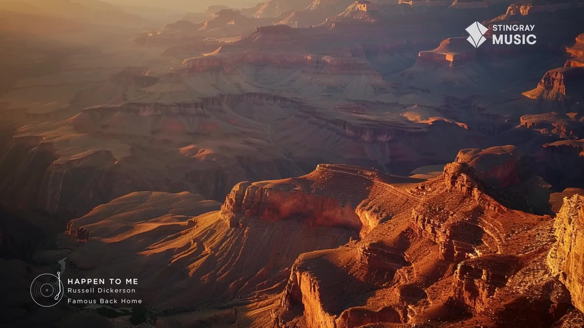The sun casts long shadows across the vast canyon walls, illuminating layers of rock in shades of orange and red. A faint river snakes through the valley floor far below. The sun casts long shadows across the vast canyon walls, illuminating layers of rock in shades of orange and red. A faint river snakes through the valley floor far below.