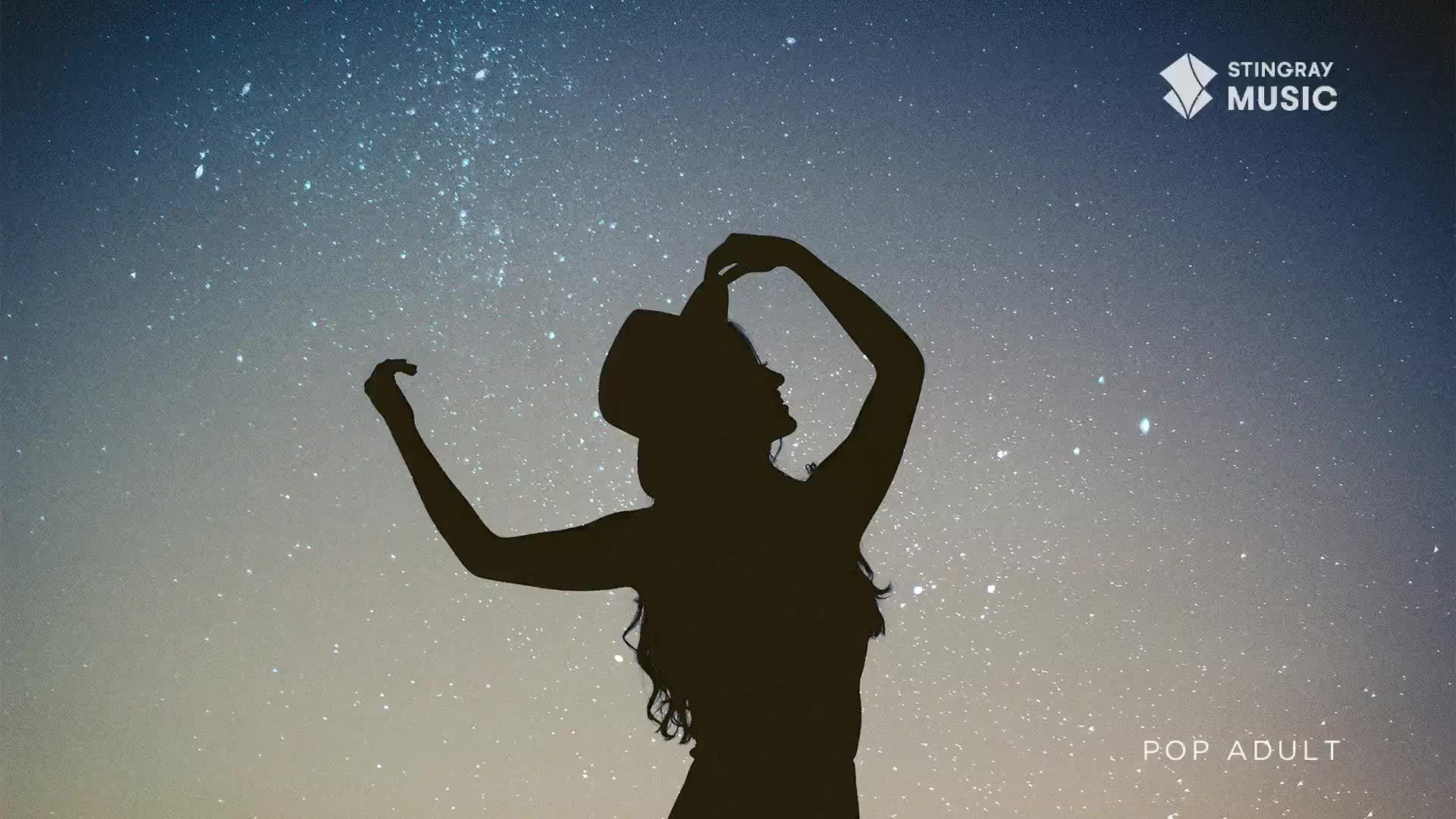 Against a starry sky, a woman in silhouette lifts her hat, arms outstretched. The Stingray Pop Adult logo sits in the corner, a reminder of the music playing.
