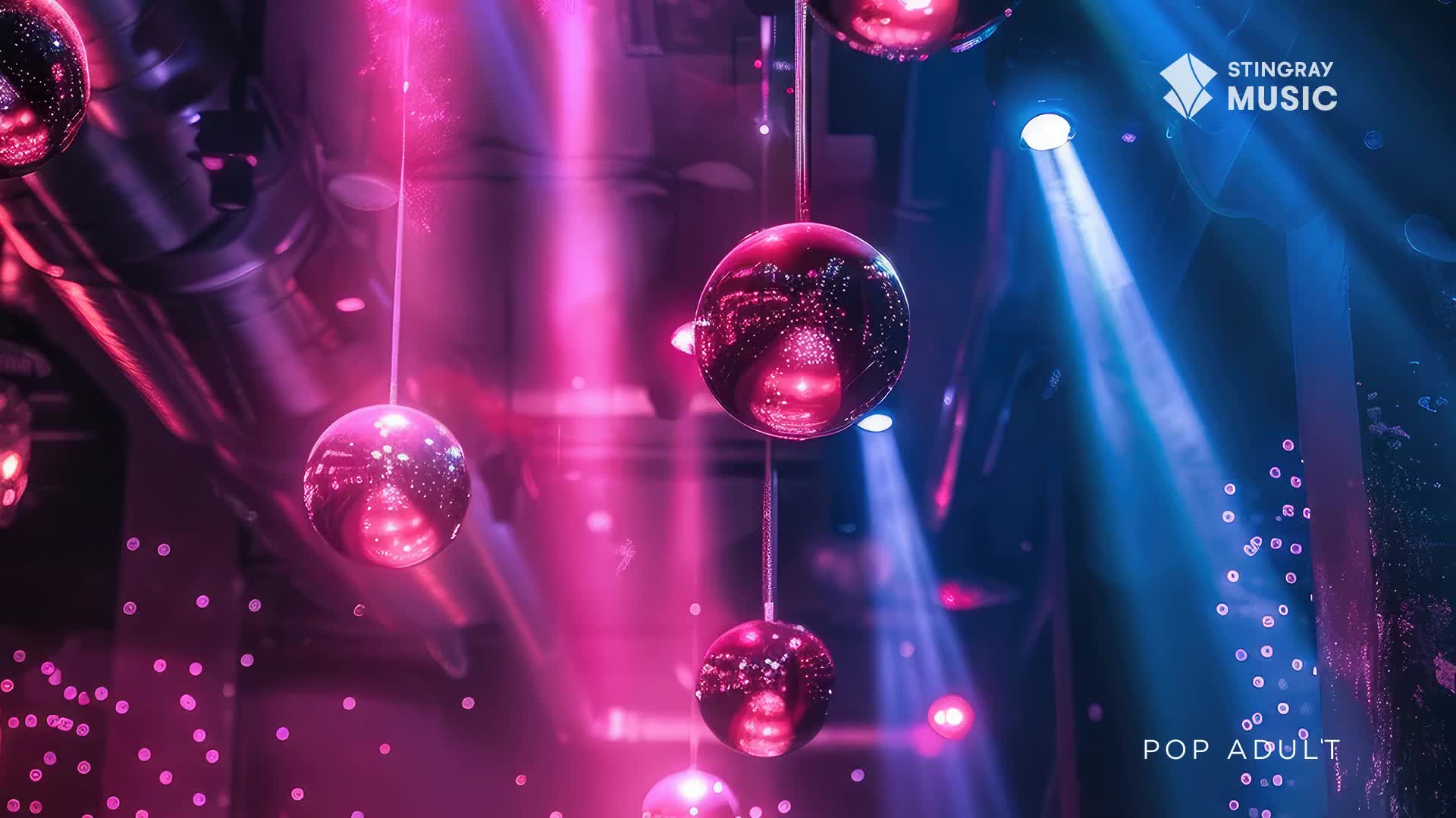 Hanging disco balls reflect pink and blue light beams, casting a vibrant glow across the space. The Stingray Pop Adult logo is in the corner, suggesting a club or event in Canada.

