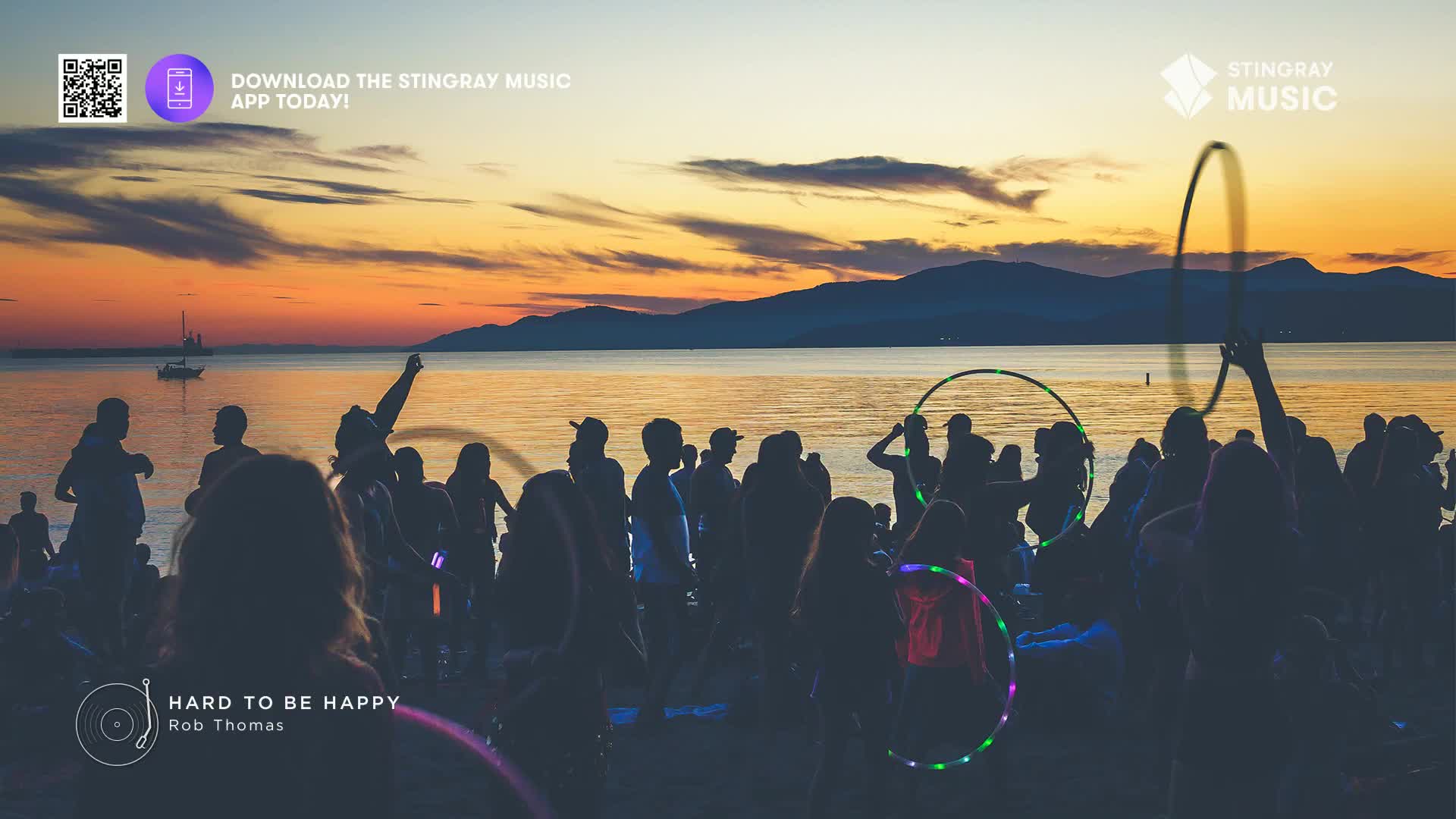 A crowd of people, silhouetted against a sunset over the water, are enjoying themselves. Some are holding up glowing hoops, and the music from Stingray Pop Adult is playing.
A crowd of people, silhouetted against a sunset over the water, are enjoying themselves. Some are holding up glowing hoops, and the music from Stingray Pop Adult is playing.
