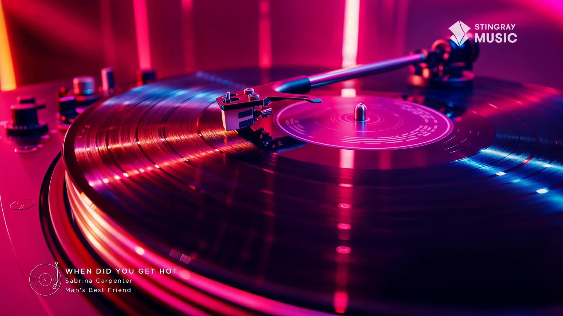 The needle rests in the groove of a spinning vinyl, reflecting the vibrant pink and blue lights. This is Sabrina Carpenter's "When Did You Get Hot," playing through Stingray Music. The needle rests in the groove of a spinning vinyl, reflecting the vibrant pink and blue lights. This is Sabrina Carpenter's "When Did You Get Hot," playing through Stingray Music.