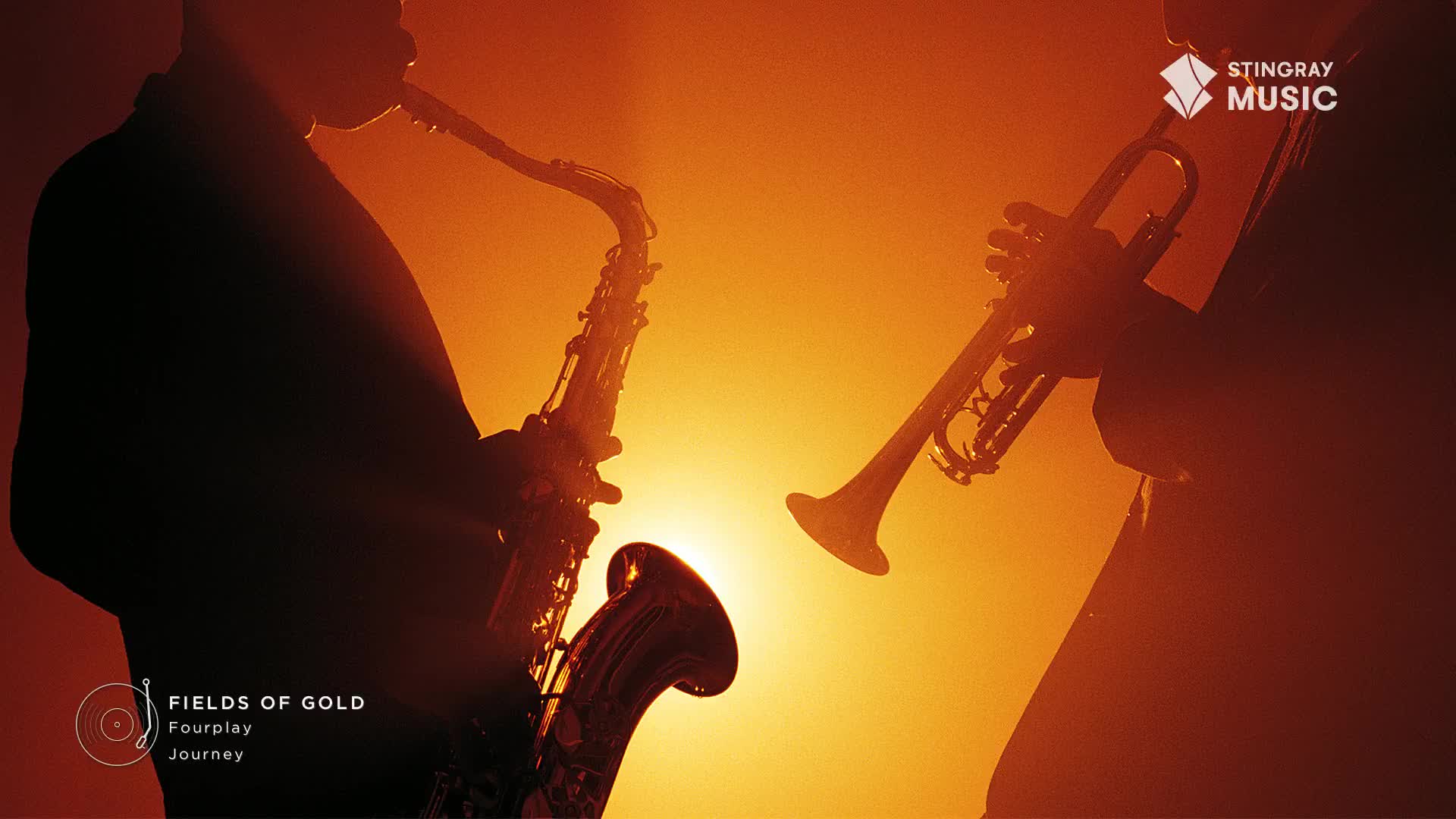 Against a warm, golden backdrop, a saxophone and trumpet are silhouetted, their forms defined by the light. The instruments, likely part of a Stingray Smooth Jazz performance, are poised, ready to fill the air with music.
