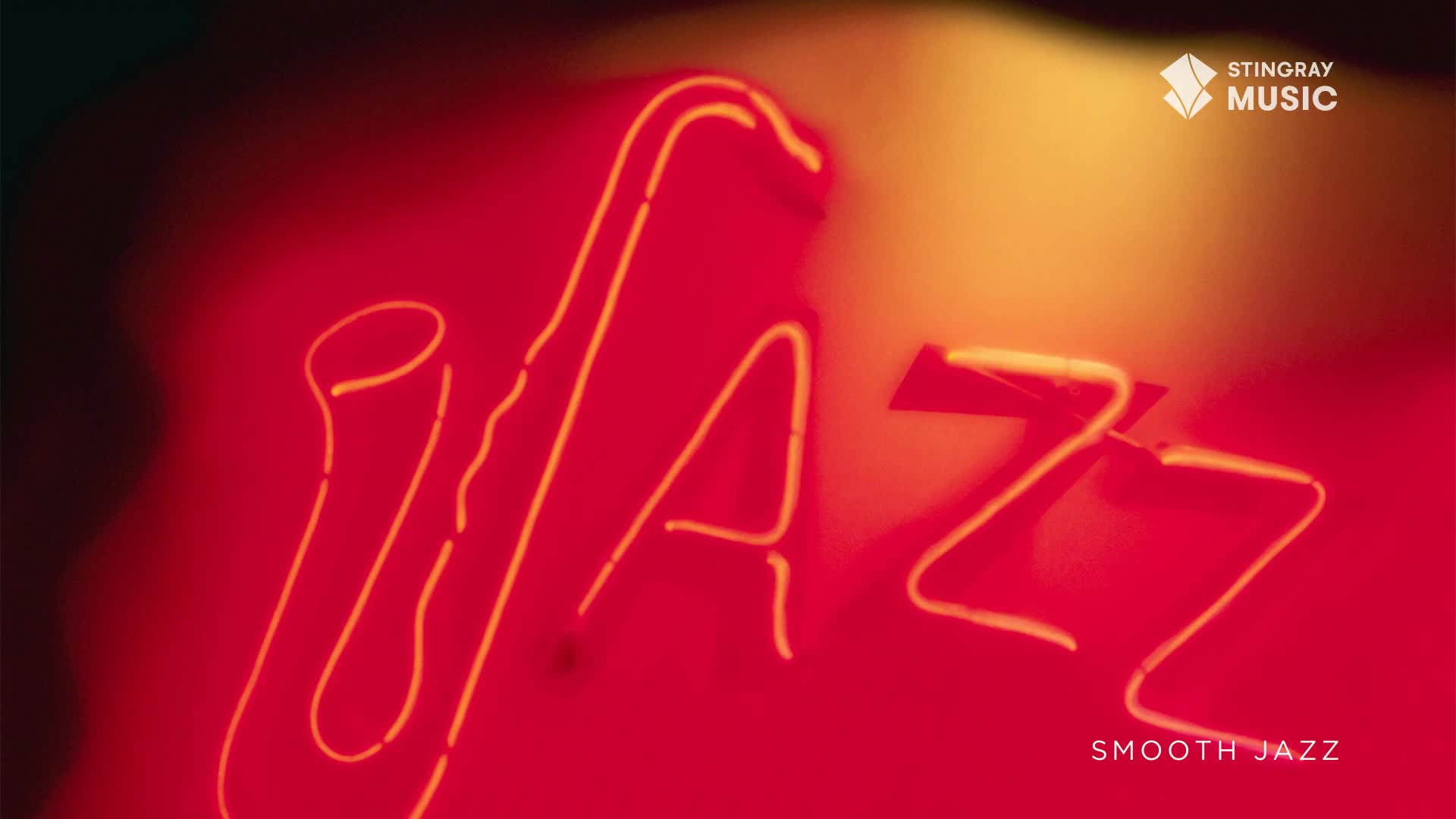 The word "JAZZ" glows in neon, with a saxophone shape overlaid, all against a deep red background. It's the kind of vibe you'd expect from Stingray Smooth Jazz, a channel from Canada, playing in a dimly lit club.
