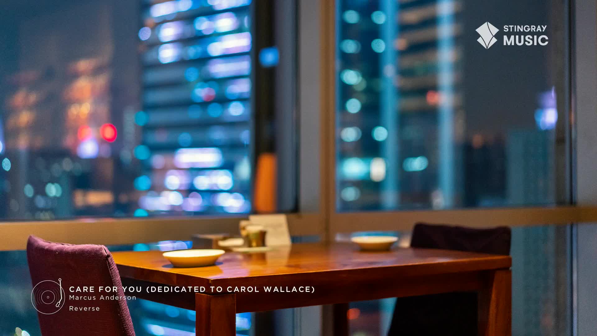 A small table sits near a window, ready for a meal, with a city's lights twinkling in the distance. The Stingray Music logo is visible, and a smooth jazz track from Canada plays softly in the background.
