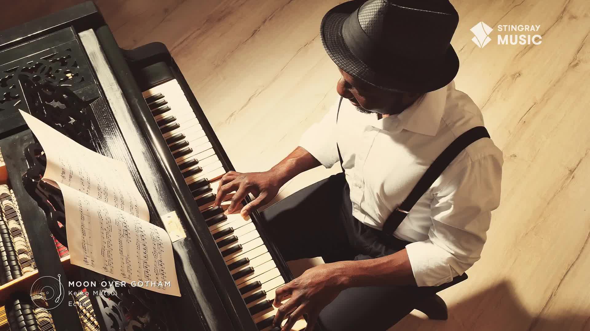 Fingers dance across the piano keys, coaxing out a melody. The sheet music for "Moon Over Gotham" lies open, a testament to the smooth jazz being played.