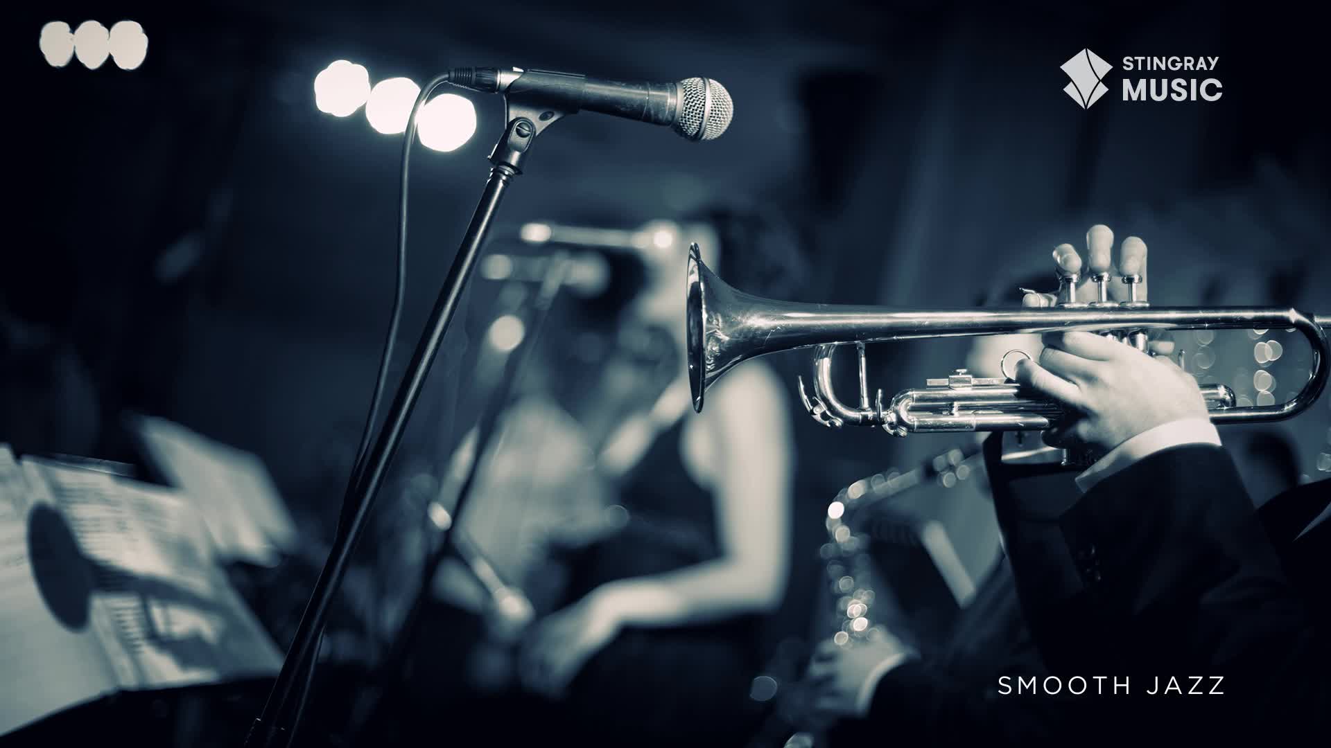 A trumpet player's fingers dance across the valves, ready to send a smooth jazz melody into the night. Behind him, a saxophone waits, and a microphone stands poised, capturing the essence of a Canadian performance.
