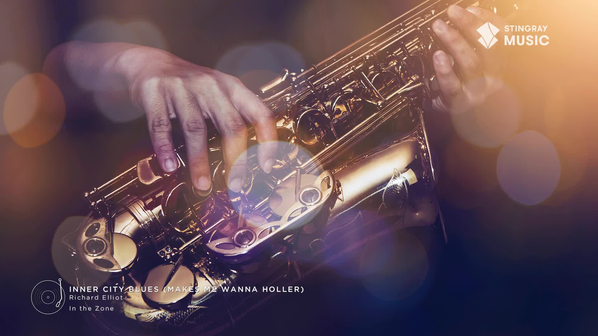 Fingers dance across the keys of a gleaming saxophone, the brass catching the light. This is Richard Elliot's "Inner City Blues," a track from his album "In the Zone," playing on Stingray Smooth Jazz.