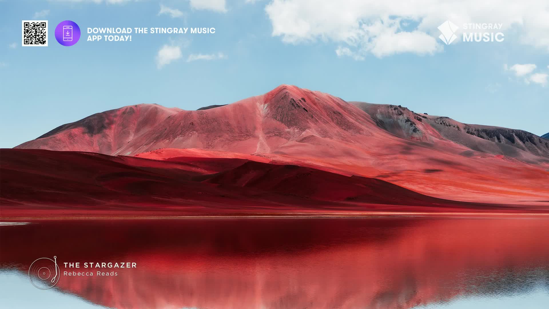 A reddish mountain range rises from a crimson lake under a pale blue sky. The Stingray Music app is promoted, and the album "The Stargazer" is playing.
