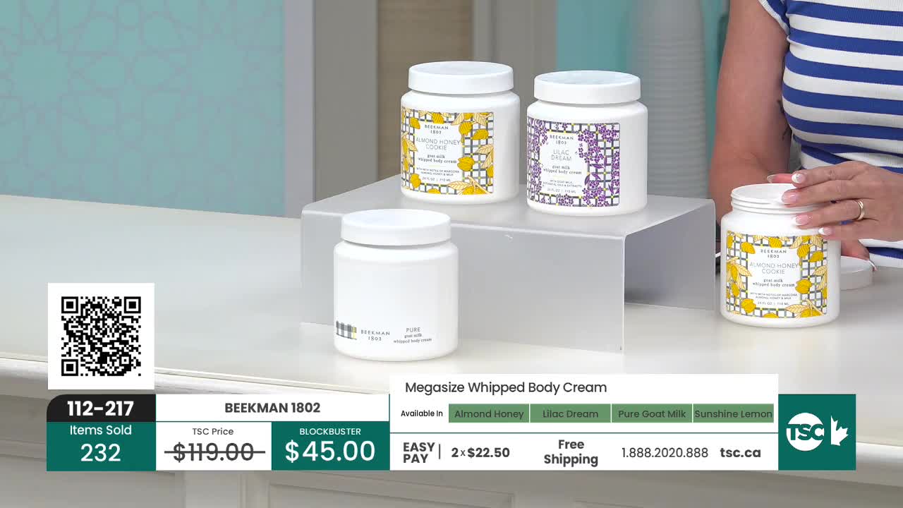 On a bright, white surface, several large white jars of body cream are displayed. A woman in a striped shirt holds one of the jars, while the on-screen graphics highlight the product's price and availability on TSC.
