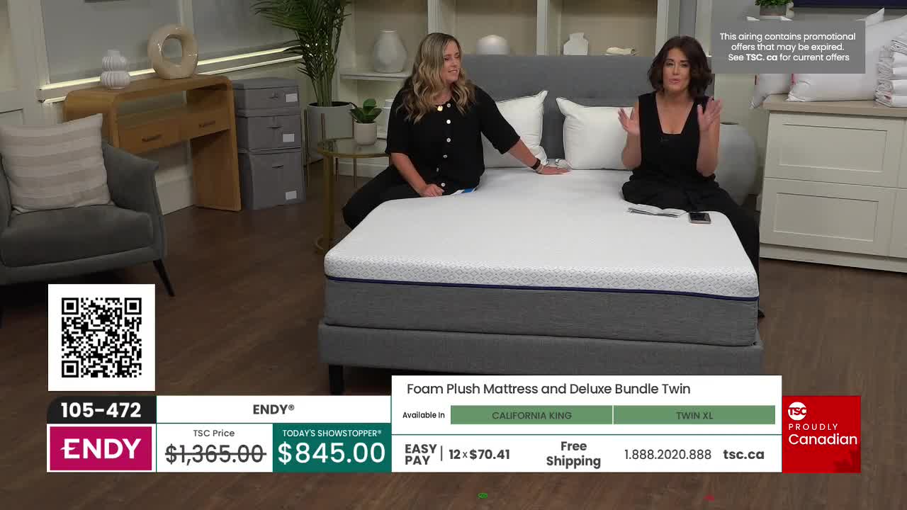 Two women sit on a large mattress, gesturing towards it. The TSC logo and a Canadian flag are visible, along with a price tag for the "Endy" mattress.
