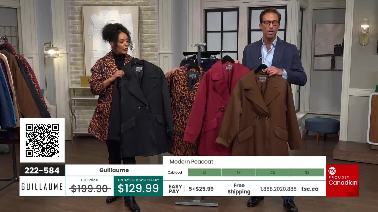 Two people stand center stage, holding up coats of different colors. The woman on the left is wearing a leopard print jacket, while the man on the right gestures toward the selection of outerwear.
