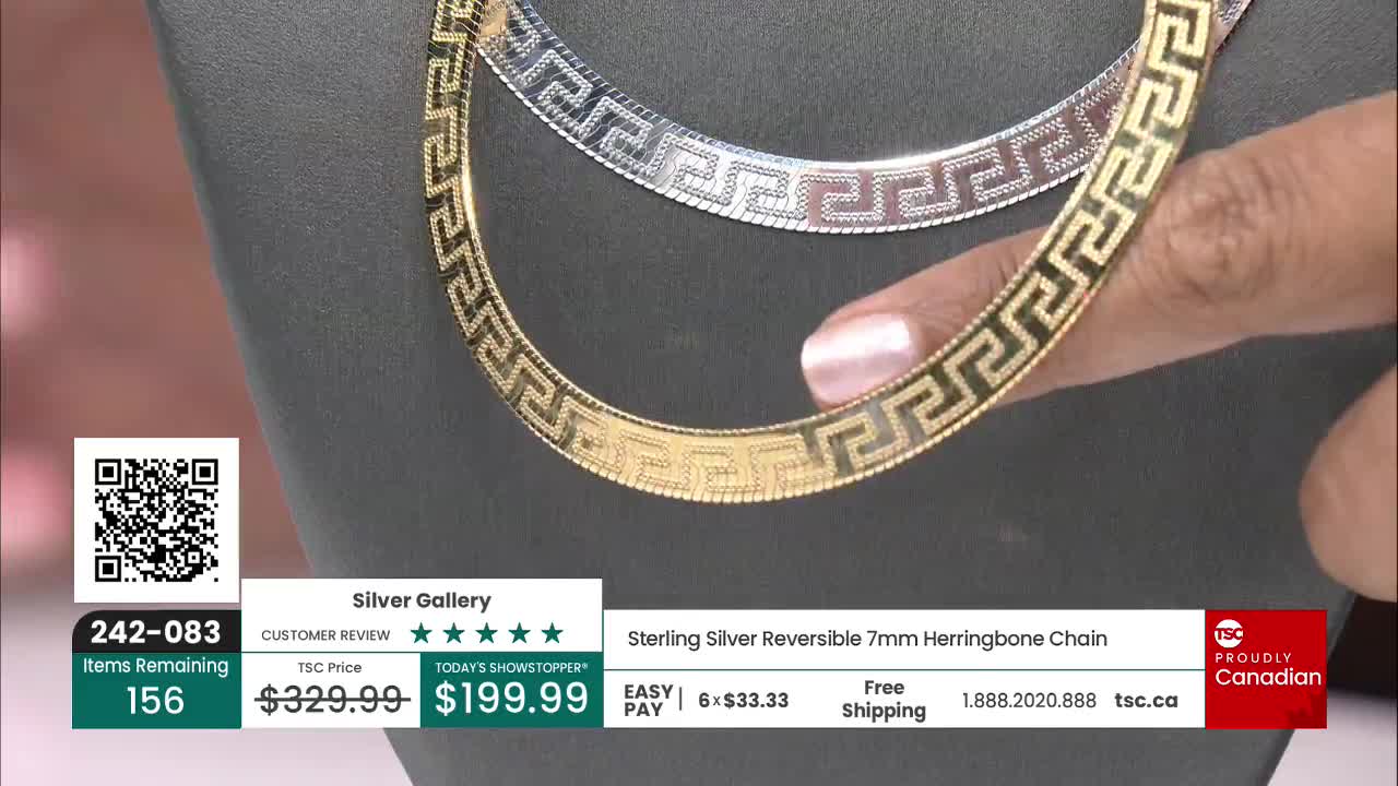 A gold-toned chain, with a repeating Greek key design, is held up for a closer look. The TSC logo and "Proudly Canadian" text are visible in the corner.
