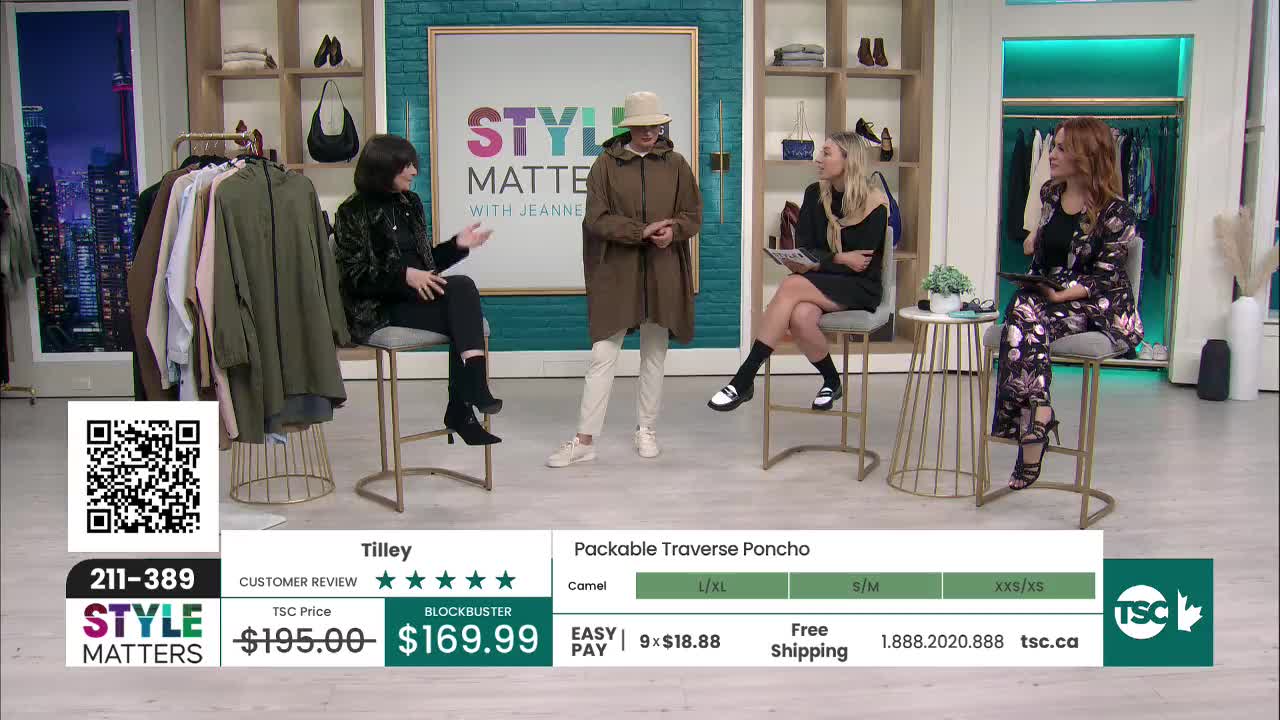 A person in a brown poncho stands between two seated women, all of them on a set for a TSC show. The bottom of the screen displays the price and details of the poncho.
