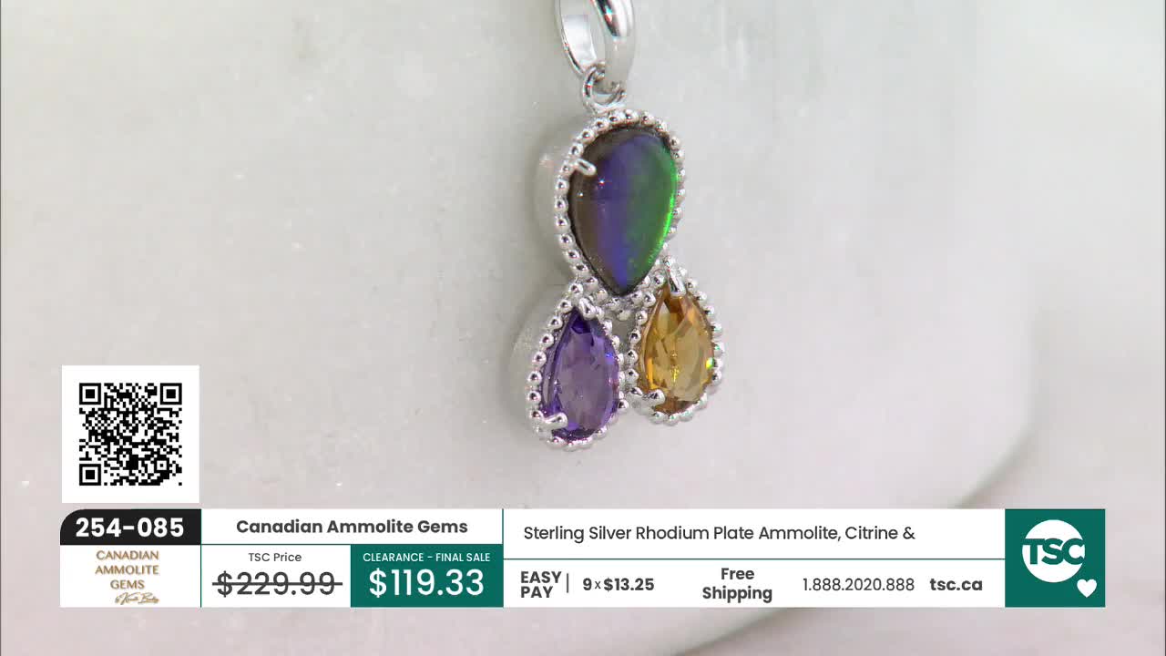 A pendant with three teardrop-shaped gemstones hangs from a silver chain. The top gem flashes green and purple, while the two below are a deep purple and a warm yellow. This Canadian Ammolite Gems piece is currently on clearance at TSC.