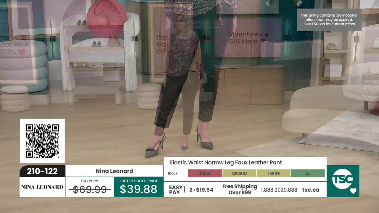 A woman in black faux leather pants and a patterned top stands with her feet apart, showcasing the fit. The pants are form-fitting, tapering to the ankle, and she wears pointed-toe heels.