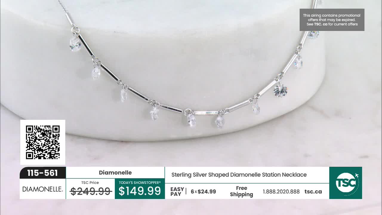 A delicate sterling silver necklace with small, clear stones hangs on a white surface. The necklace, featuring a Diamonelle design, is currently a "Today's Showstopper" on TSC.