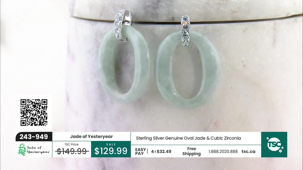 A pair of oval jade earrings with cubic zirconia accents hangs from a marbled surface. The TSC logo and product details are displayed on a graphic overlay. A pair of oval jade earrings with cubic zirconia accents hangs from a marbled surface. The TSC logo and product details are displayed on a graphic overlay.