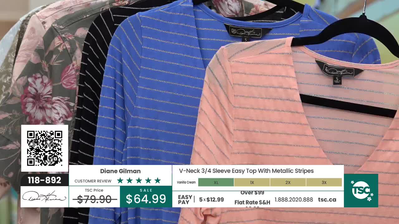 A row of women's tops hangs on black hangers, each with a V-neck and subtle metallic stripes. The closest top is a soft peach, followed by a vibrant blue, a black and white striped one, and a floral print. Information about the Diane Gilman V-Neck 3/4 Sleeve Easy Top with Metallic Stripes, including its sale price and easy pay option, is displayed on screen. A row of women's tops hangs on black hangers, each with a V-neck and subtle metallic stripes. The closest top is a soft peach, followed by a vibrant blue, a black and white striped one, and a floral print. Information about the Diane Gilman V-Neck 3/4 Sleeve Easy Top with Metallic Stripes, including its sale price and easy pay option, is displayed on screen.