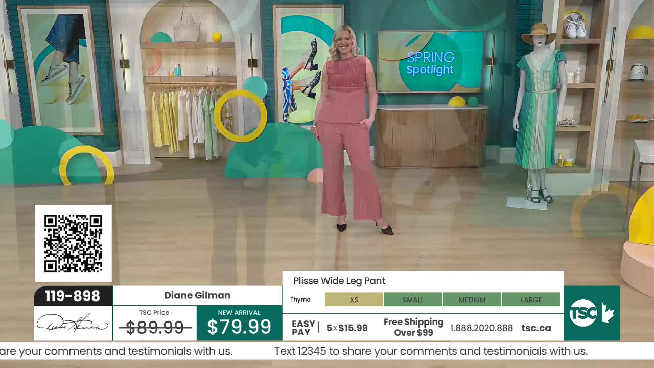 A woman stands on a studio floor, showcasing a rose-colored pant suit. A mannequin to her right displays a green and white striped dress. A woman stands on a studio floor, showcasing a rose-colored pant suit. A mannequin to her right displays a green and white striped dress.