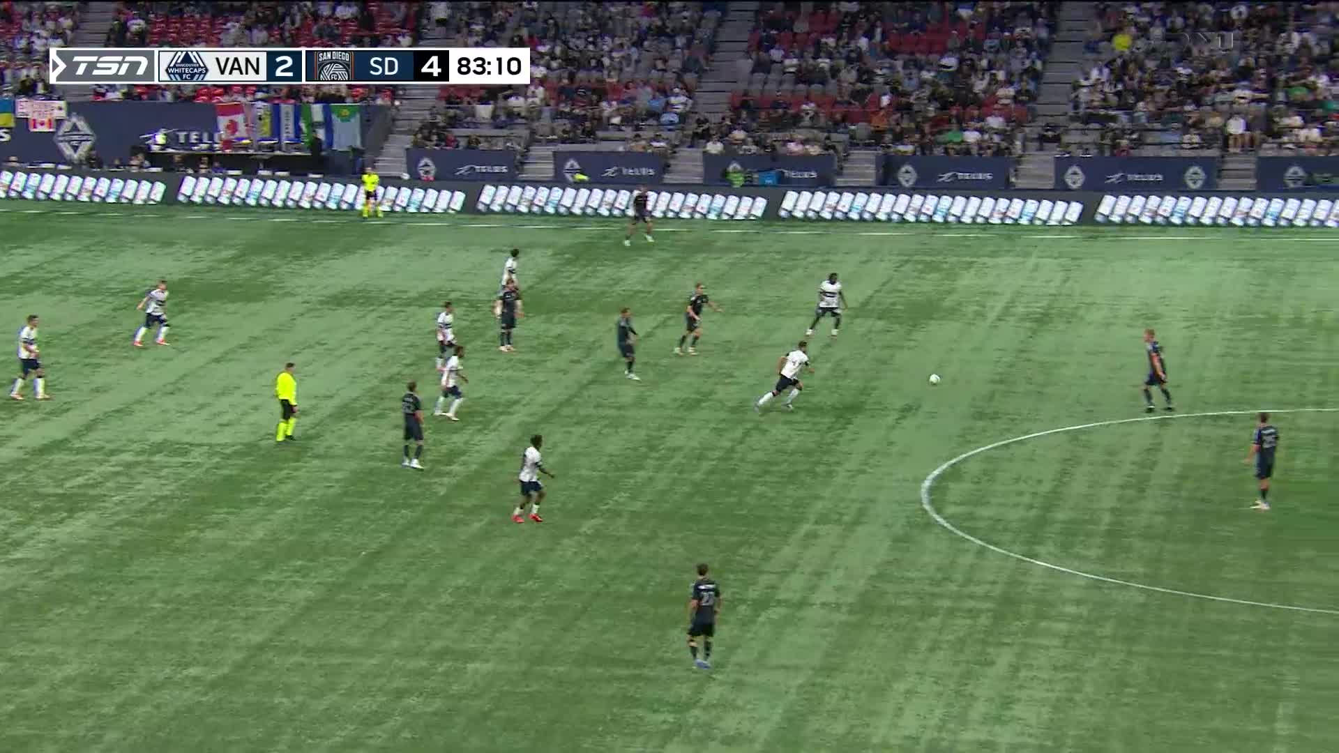 The player in white is dribbling the ball, angling toward the goal. The clock on TSN1 shows it's late in the game, with the score favouring San Diego.

