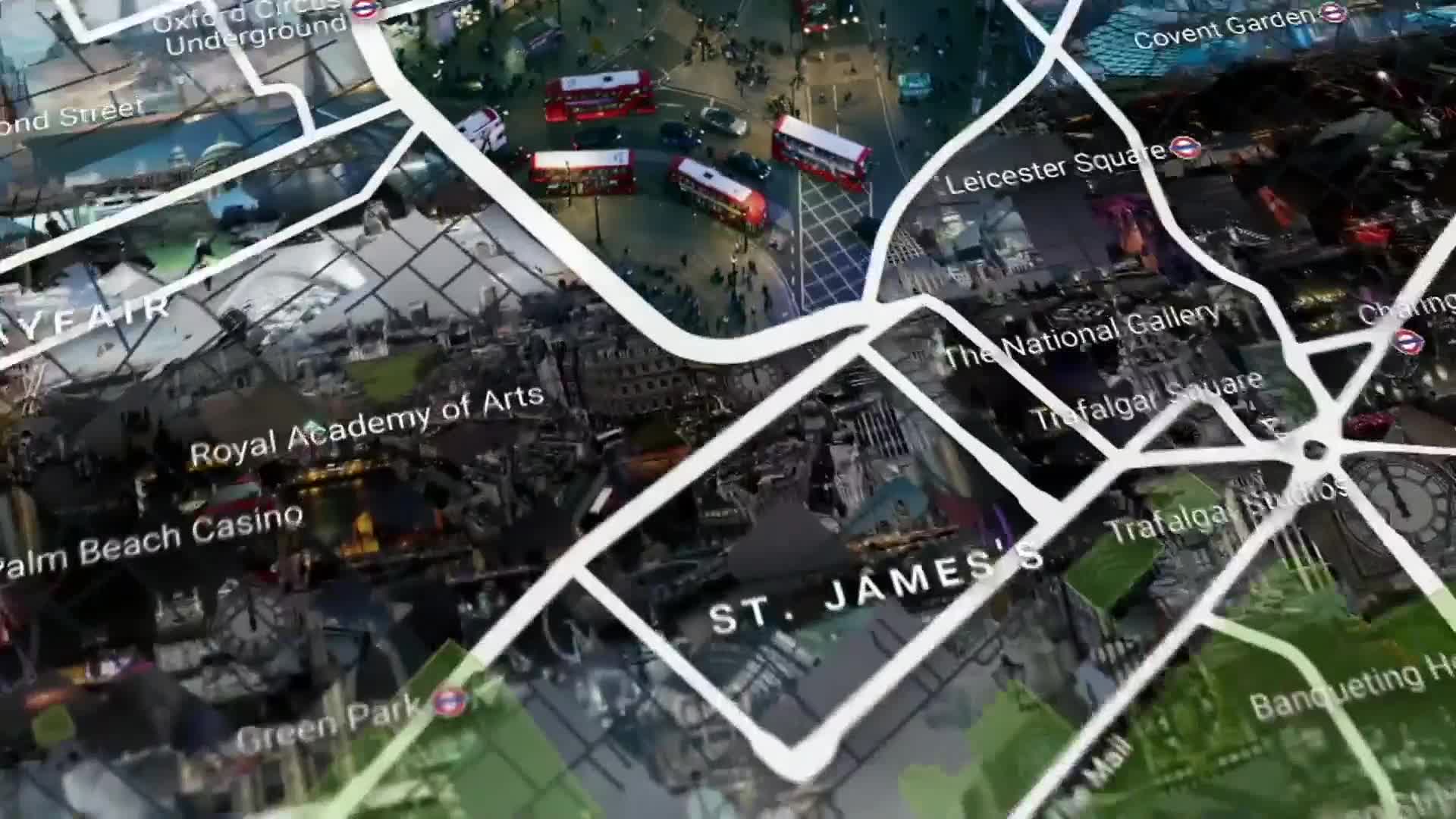 Red double-decker buses navigate a busy intersection near Leicester Square. The city lights of London glow beneath a digital map overlay. Red double-decker buses navigate a busy intersection near Leicester Square. The city lights of London glow beneath a digital map overlay.