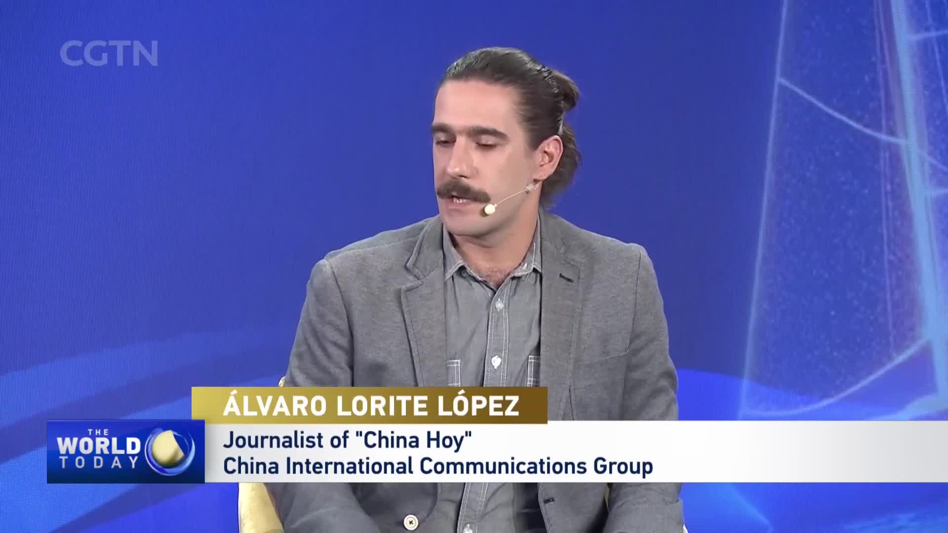 Álvaro Lorite López, a journalist for "China Hoy" with China International Communications Group, speaks from a studio. The CGTN logo appears in the upper left corner.