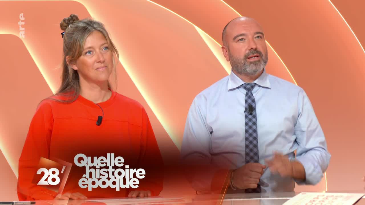 A woman in a bright orange sweater sits to the left, while a man in a blue shirt and tie gestures with his hands. The "arte" logo is visible in the corner, and the show's title is displayed at the bottom.
