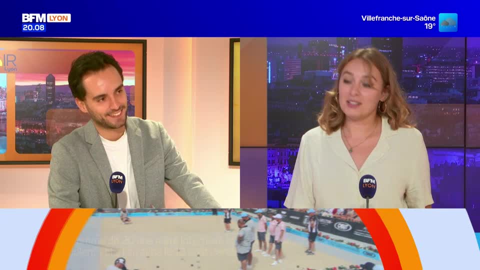 In the BFM Lyon studio, a man in a gray jacket smiles as a woman in a cream blouse speaks. Below them, a live feed shows people playing a game on a sandy court.
