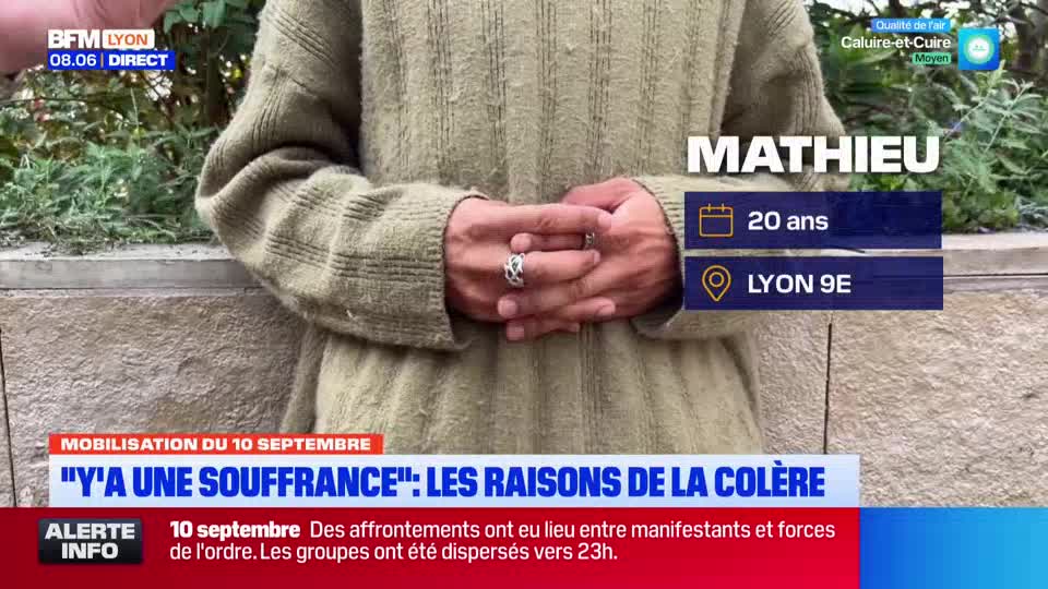 A young man, identified as Mathieu from Lyon 9e by BFM Lyon, has his hands clasped in front of him. He wears a light green sweater, and a news report about a protest in France is displayed below.
