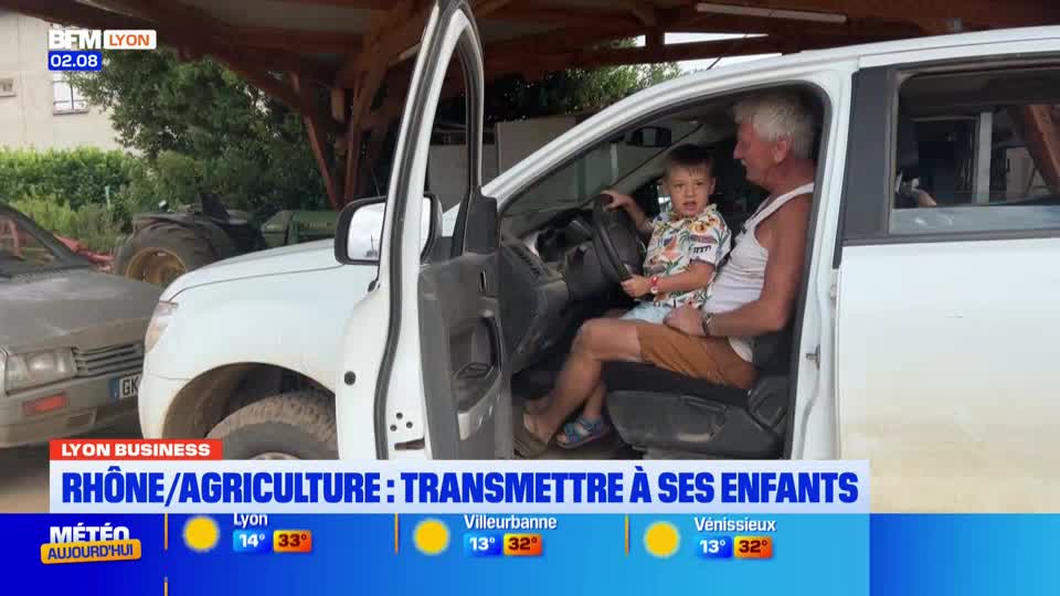 A man and a young boy sit in a white truck, the boy gripping the steering wheel. The BFM Lyon segment is about passing down the family farm.
