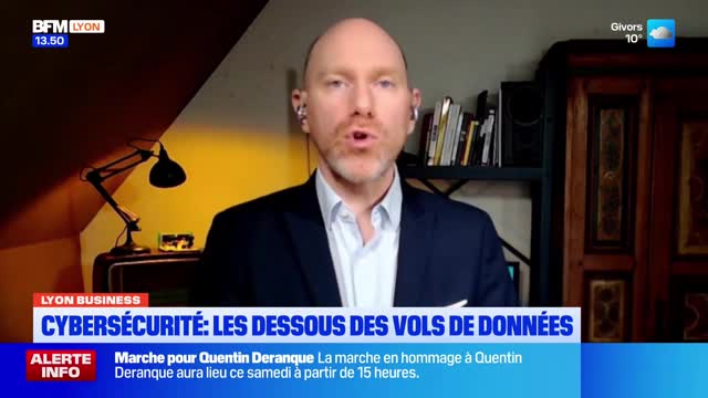 A man in a suit speaks directly to the camera, his mouth open mid-sentence. Below him, a BFM Lyon chyron announces "Cybersecurity: The Underbelly of Data Theft." A man in a suit speaks directly to the camera, his mouth open mid-sentence. Below him, a BFM Lyon chyron announces "Cybersecurity: The Underbelly of Data Theft."