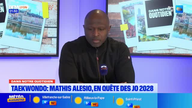 A man in a black jacket sits at a desk, looking down. Behind him, a screen displays the BFM Lyon logo and photos of what appear to be French cityscapes. A man in a black jacket sits at a desk, looking down. Behind him, a screen displays the BFM Lyon logo and photos of what appear to be French cityscapes.