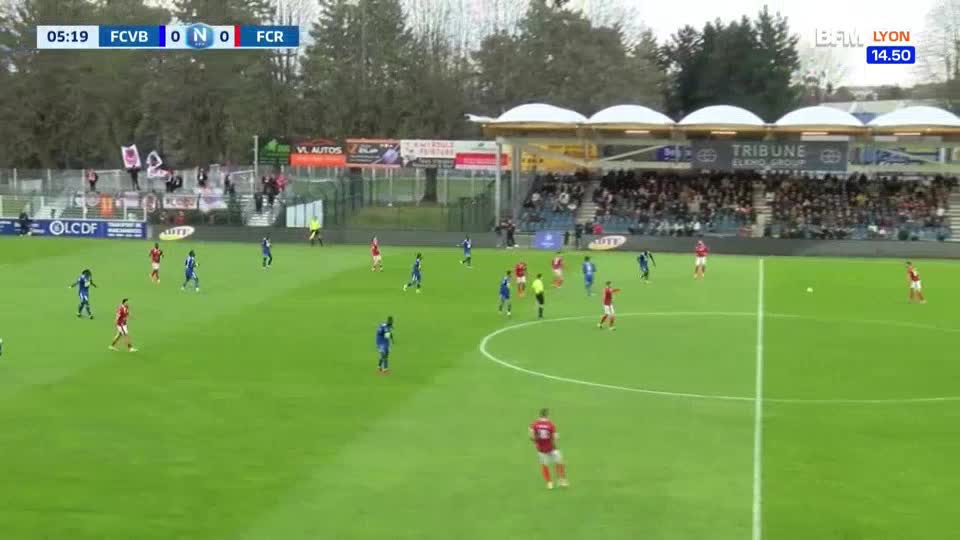 A player in red sprints down the right side of the pitch, looking to make a pass. On the left, a player in blue receives the ball near the sideline. A player in red sprints down the right side of the pitch, looking to make a pass. On the left, a player in blue receives the ball near the sideline.