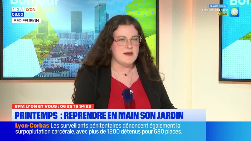 A woman with glasses and long, dark hair speaks into a microphone. Behind her, a screen displays a cityscape with the BFM Lyon logo. A lower banner announces a segment about gardening in spring and a report on prison overcrowding in Lyon-Corbas.