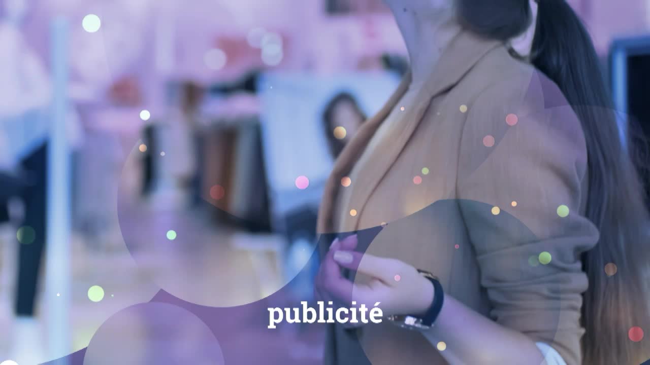 A woman in a tan blazer is partially visible, with the word "publicité" overlaid in French. The scene is awash in soft, colorful orbs and a blurred background, perhaps on Canal 32 in France.
