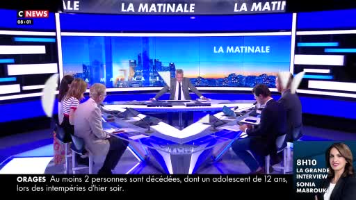 The CNews studio is bustling; a panel of people are seated around a large, modern desk. The news anchor is speaking, gesturing towards the screen displaying "LA MATINALE" and a breaking story about storms.
