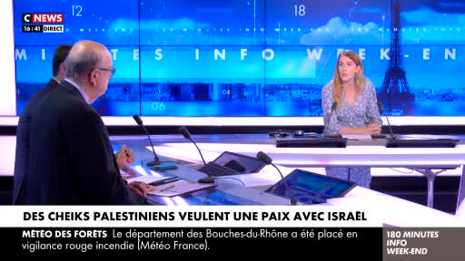 A woman in a floral dress speaks into a microphone at a desk, while two men in suits are turned away from the camera. The CNews logo and a graphic about weather alerts from Météo France are visible on the screen.
