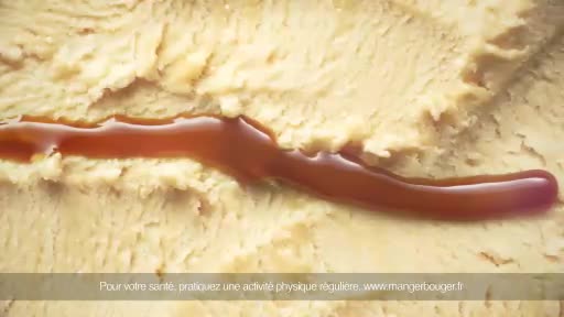 A thick, glossy stream of caramel sauce snakes across a textured, pale-yellow surface. The French text at the bottom urges viewers to exercise regularly for their health.

