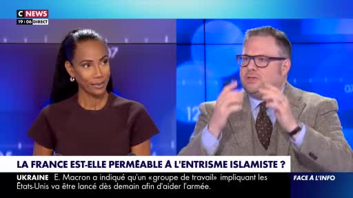 On CNews, a woman in a dark top listens intently as a man in a tweed jacket gestures emphatically. The screen shows the question, "Is France permeable to Islamist infiltration?"
