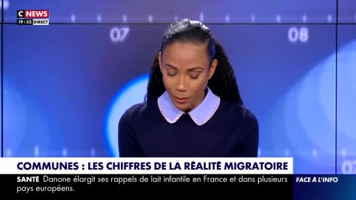 A woman with dark, braided hair is speaking, her gaze directed downwards. A graphic overlay at the bottom of the screen displays the CNews logo and a headline about migration figures in France.