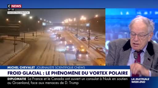 Snowplows are clearing a highway at night, their lights cutting through the falling snow. Cars are moving slowly on the slushy road, headlights reflecting off the wet surface.