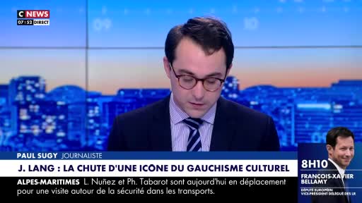 A CNews broadcast shows a journalist with glasses, looking down at his notes. A graphic beneath him displays the headline "J. LANG: THE FALL OF A CULTURAL GAULLISM ICON."