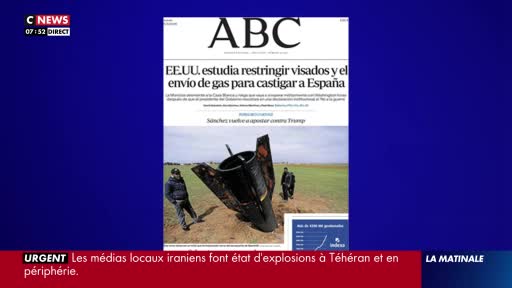 A newspaper headline in Spanish reads "USA studies restricting visas and gas shipments to punish Spain." Two men stand near a damaged missile in a field, as reported by CNews.