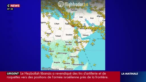 Dozens of airplanes are tracked across the map of Africa and the Middle East. A C News chyron at the bottom of the screen indicates an urgent report about Hezbollah.