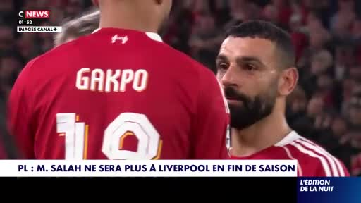 Mohamed Salah looks intently at Cody Gakpo, whose back is to me, as the CNews broadcast displays a headline about Salah's departure from Liverpool. The crowd behind them is a muted backdrop to the intense focus between the two players. Mohamed Salah looks intently at Cody Gakpo, whose back is to me, as the CNews broadcast displays a headline about Salah's departure from Liverpool. The crowd behind them is a muted backdrop to the intense focus between the two players.