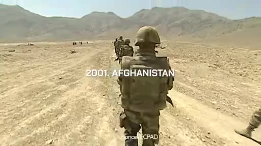 A line of soldiers marches down a dusty track under a vast, mountainous sky. Their gear is heavy, their helmets low, as they move through the arid landscape. A line of soldiers marches down a dusty track under a vast, mountainous sky. Their gear is heavy, their helmets low, as they move through the arid landscape.