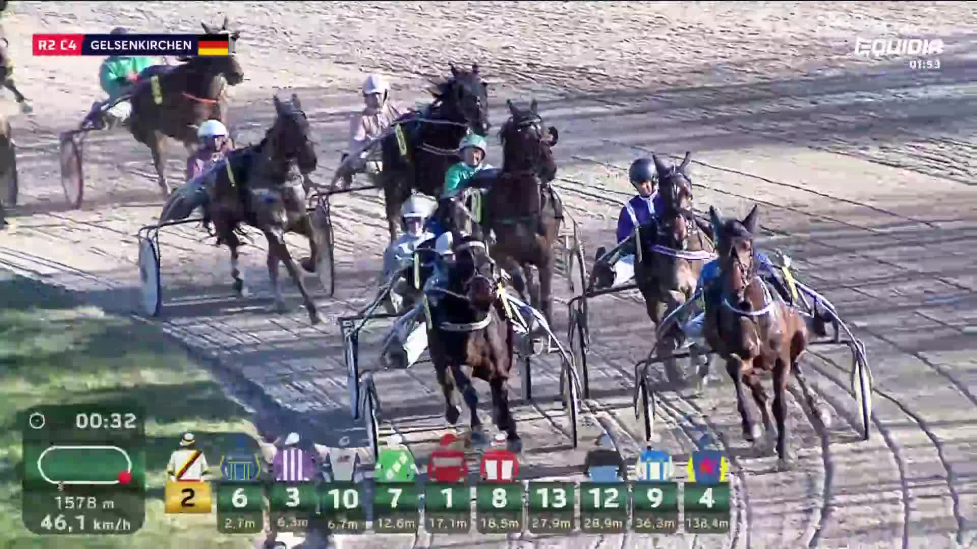 The horses are powering down the stretch, their hooves kicking up dust. A driver in a blue and white silks is pulling ahead, urging his horse forward.