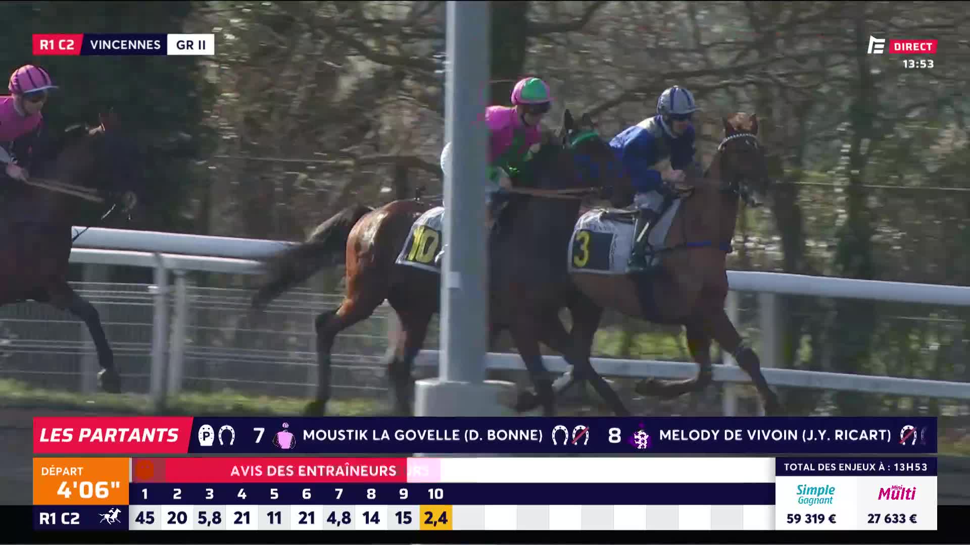 The horses are thundering down the track, their riders hunched low. Number 3, Melody de Vivoin, is pulling ahead with J.Y. Ricart in the saddle.